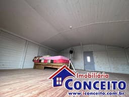 C555 - Residência de madeira localizada no balneário Albatroz